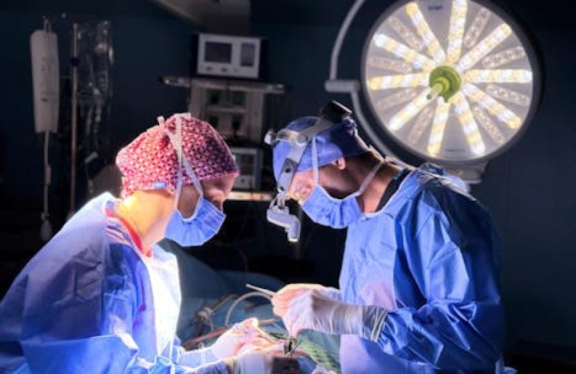 Professional surgical team in action in an operating room with focus on precision and teamwork.